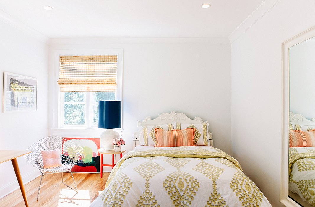 In Lucy’s bedroom, a glossy navy lampshade stands out as the one deep tone in an otherwise airy palette—a typically fun Pencil & Paper touch.
