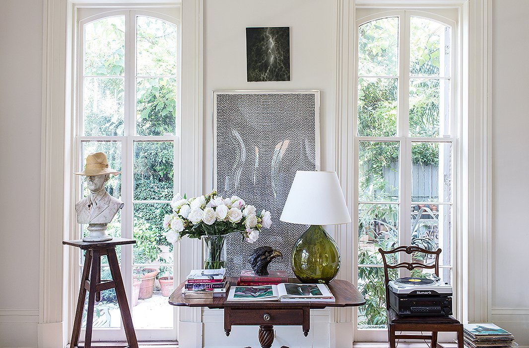 A wooden sculpture stand topped with a classic plaster bust gets a cheeky update in the form of a wide-brimmed hat. Photo by Nicole LaMotte.
