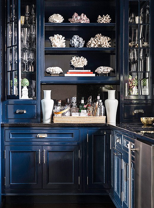 Sometimes a coat of paint is the best zhushing move. When the family first moved in, the bar was “old school and very masculine,” Sue says. But now that it’s been painted a deep glossy blue, a shade inspired by Pinterest hunts, the space feels sexier and more modern.
