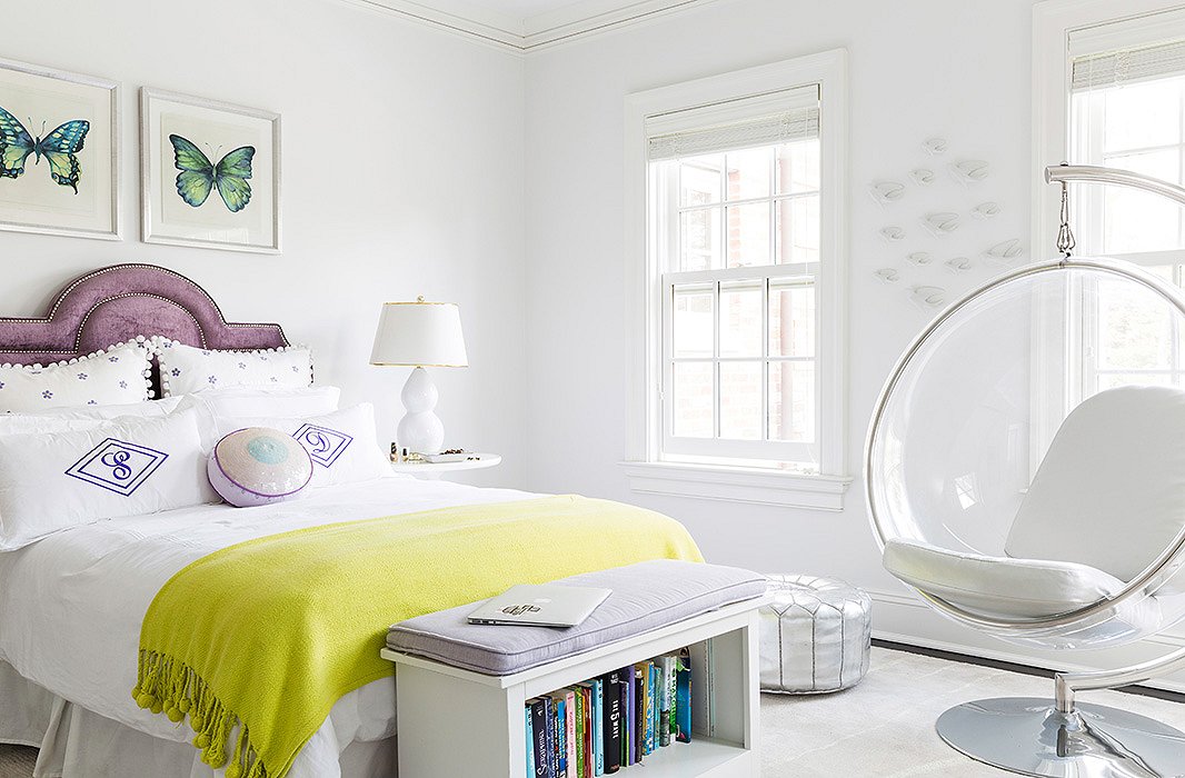 In the room of one of her daughters, a bubble chair adds a drop of wild style to the pared-down atmosphere. “She was very minimalist in what she wanted—white walls, no window treatments, no clutter.”
