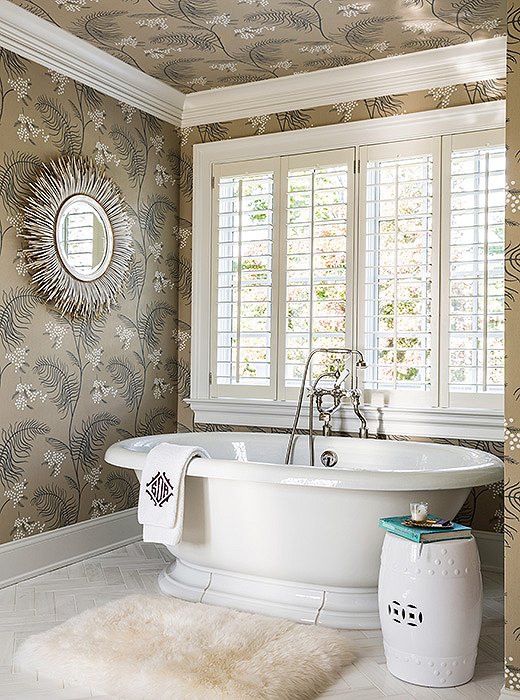 Sue got to indulge in another of her many “wallpaper crushes” in the master bathroom. Find the garden stool here.
