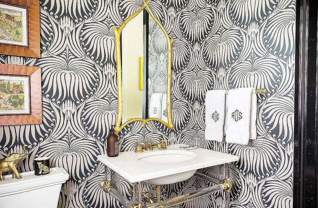 Farrow & Ball’s Lotus motif covers the walls of this powder room. Sue recommends Googling any wallpaper you like, to “see it in as many room situations as possible. It’s so much better than trying a little sample on the wall.”
