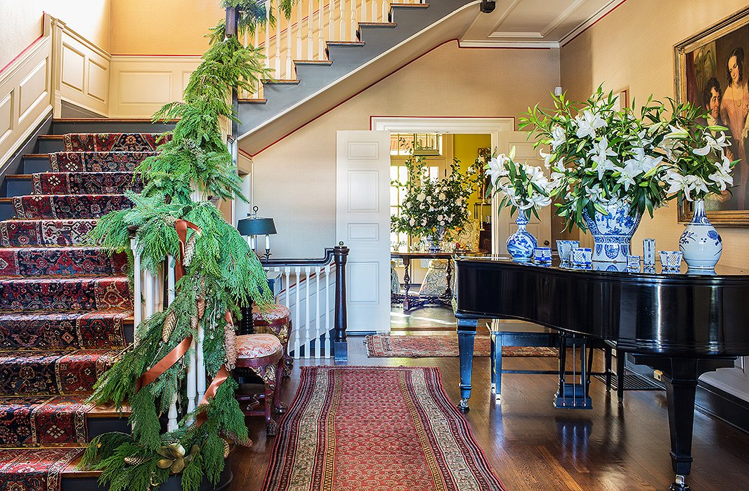 The piano provides another opportunity for Rheinstein to showcase her collection of blue-and-white vases and accessories—and to show off another bold arrangement.
