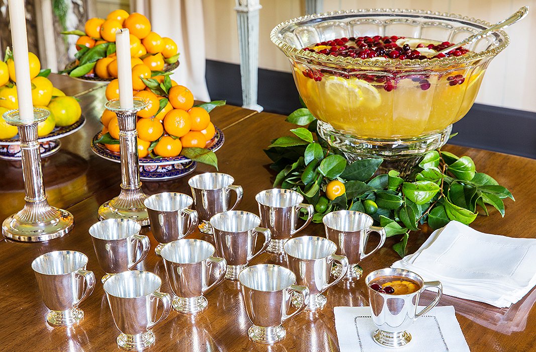 Punch is always a crowd-pleaser, and it allows the hostess to attend to last-minute details in the kitchen rather than being tied up taking drink requests.
