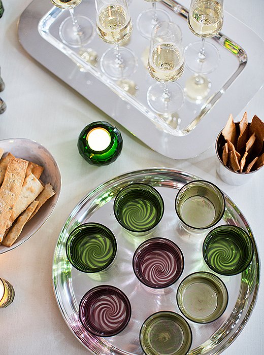 The vintage green David Hicks tumblers were found in Paris, and the Venini swirl glassware is from Paris boutique Muriel Grateau.
