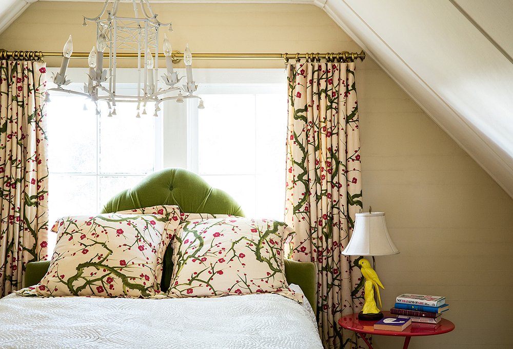 Step into the guest bedroom and the first thing that will catch your eye is the Clarence House fabric adorning the pillows, the bed skirt, and the curtains. “Symmetry feels very calm to me,” says Chloe. “It feels formal in a way that I enjoy.”
