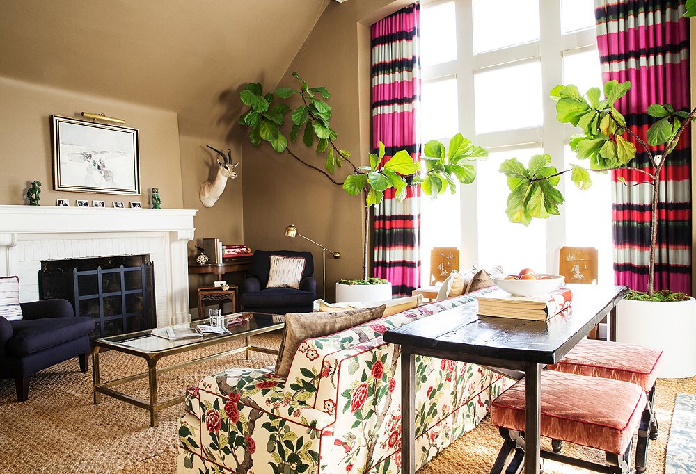 Demonstrating her penchant for a patternful mix, a sofa upholstered in Lee Jofa fabric (“big, old-lady florals are kind of my thing,” says Chloe) riffs off curtains made from Élitis’s India fabric.
