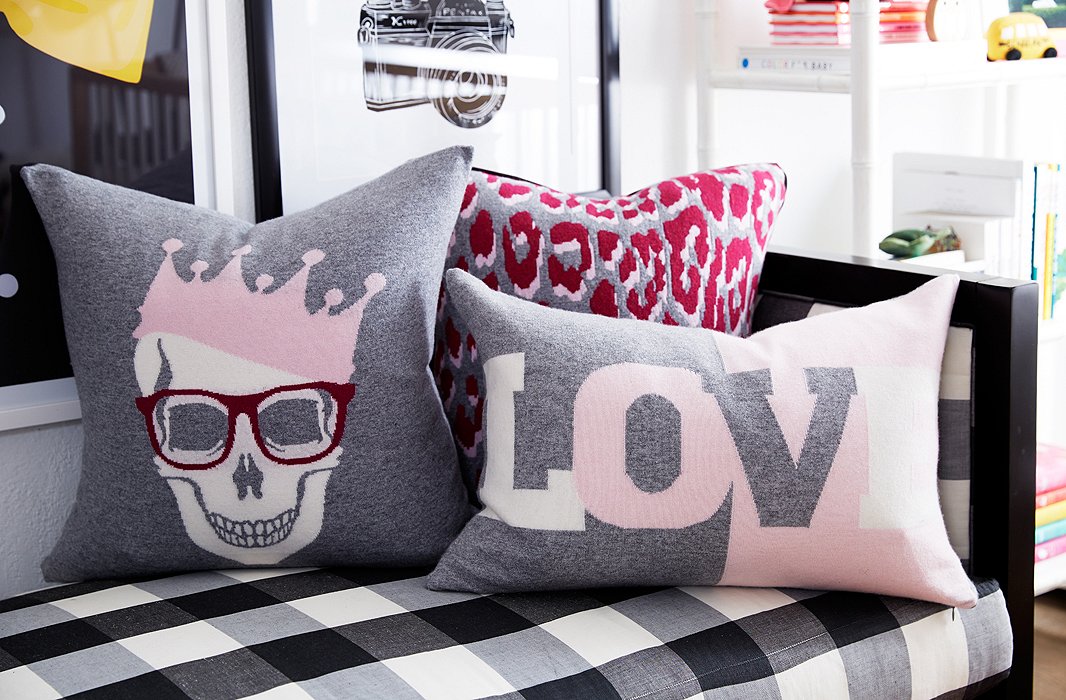 The softer the better: You can never have too many blankets and pillows. Here, we layered in some softer pinks, in the form of graphic designs and animal prints.
