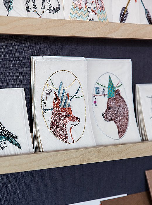 A fox and a bear face off on embroidered birthday cards, meant to be cherished as keepsakes rather than recycled like paper cards.
