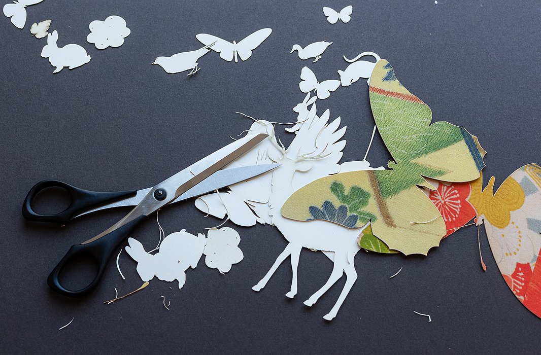Wolfe draws her forest creatures freehand before having them die-cut. To play up the details, she finishes the job by hand. The tedious work is a “tactile and visceral experience.”
