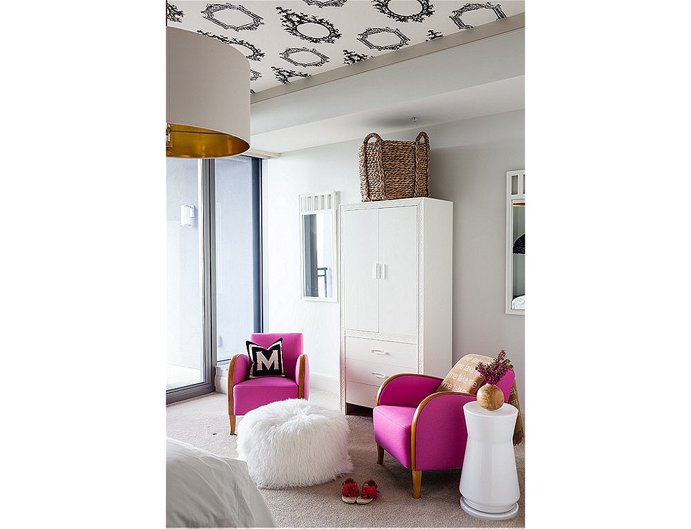 A cylindrical side table and ottoman are the perfect counterparts to leggy chairs.
