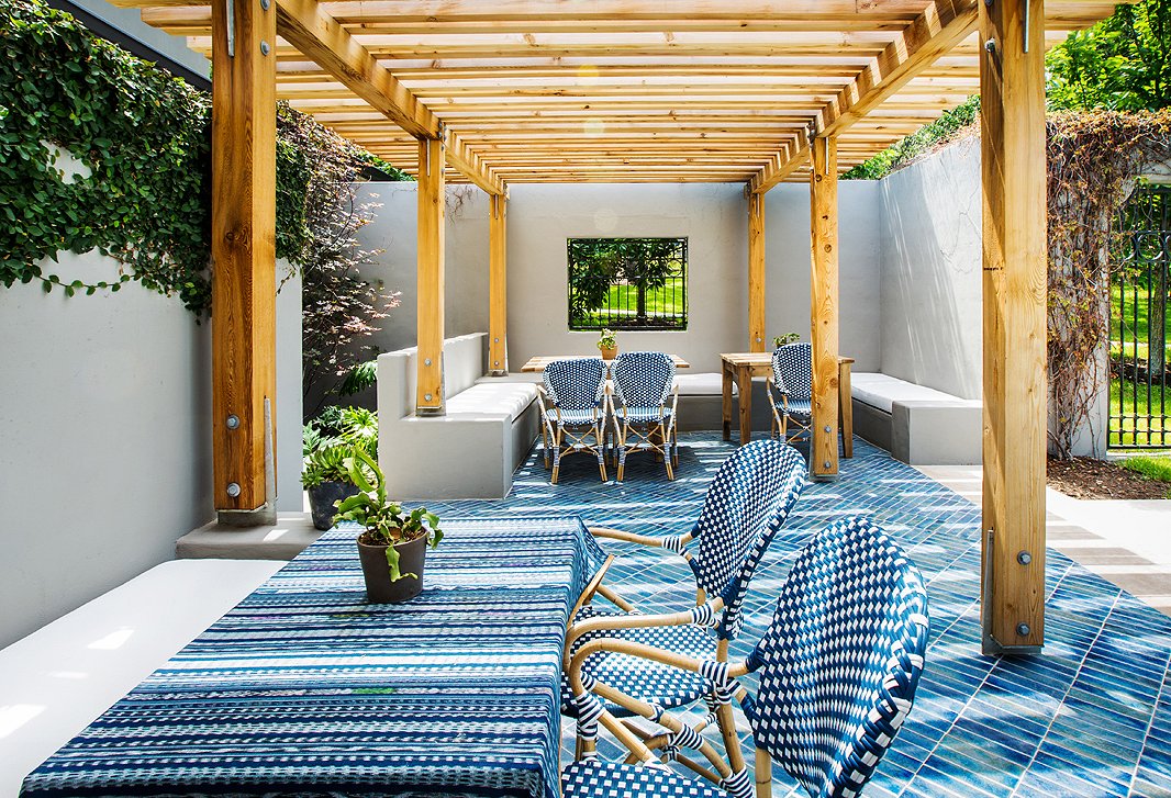 After guests expressed a desire to sip and sup alfresco, the hotel built this arbor. Tile from Ann Sacks’s Design & Direct Source and bistro chairs complete the dreamy sidewalk café feel.
