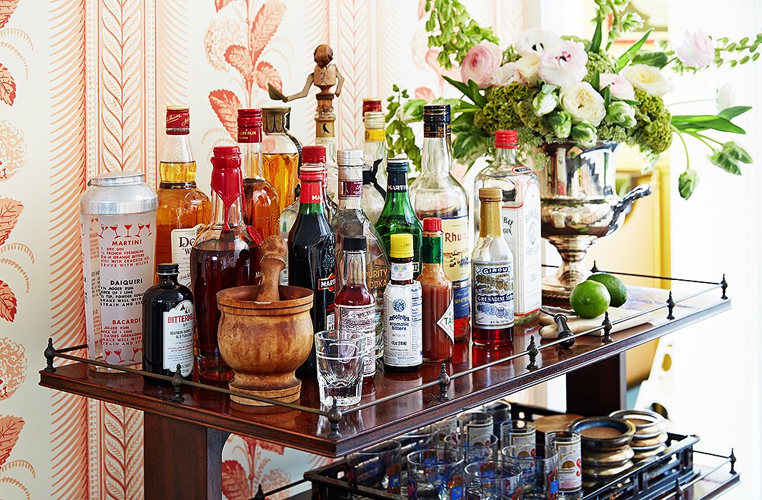 An enviably robust bar complete with fixings, mixers, and tools is a lively addition to the entryway. “Cocktails at six, dinner at seven, nightly without fail!” says Jeffrey of his genteel evening agenda. His go-to tipple? “Maker’s Mark whiskey sour with lots of citrus.”
