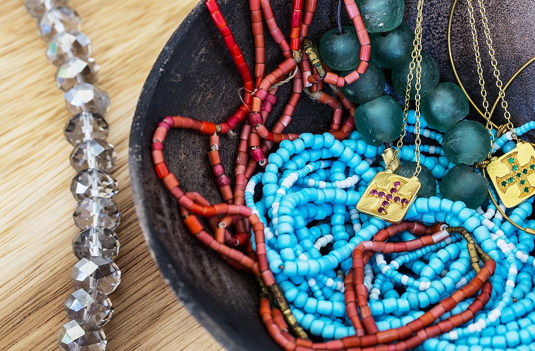 Jewelry is casually stashed in a handcrafted Ecuadoran bowl. “I don’t wear a lot of jewelry, but I do periodically throw on some organic things like turquoise or coral beads or pearls with summer dresses.”
