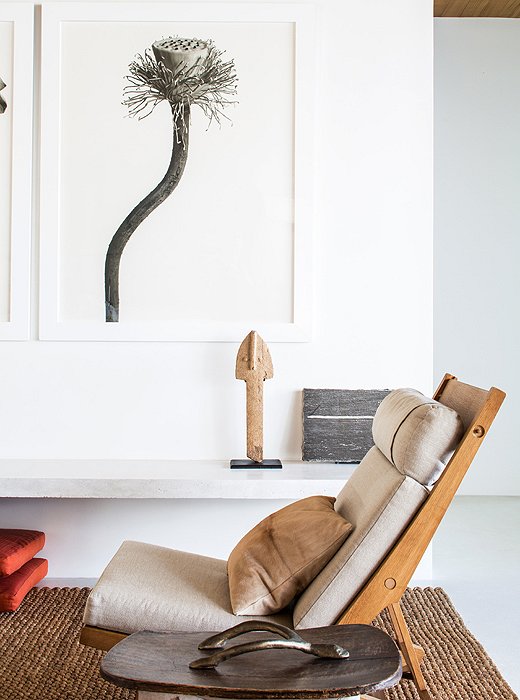 A solitary poppy, captured by photographer Anita Calero, and an antique sand-colored sculpture from Mali share the same elegant simplicity of form.
