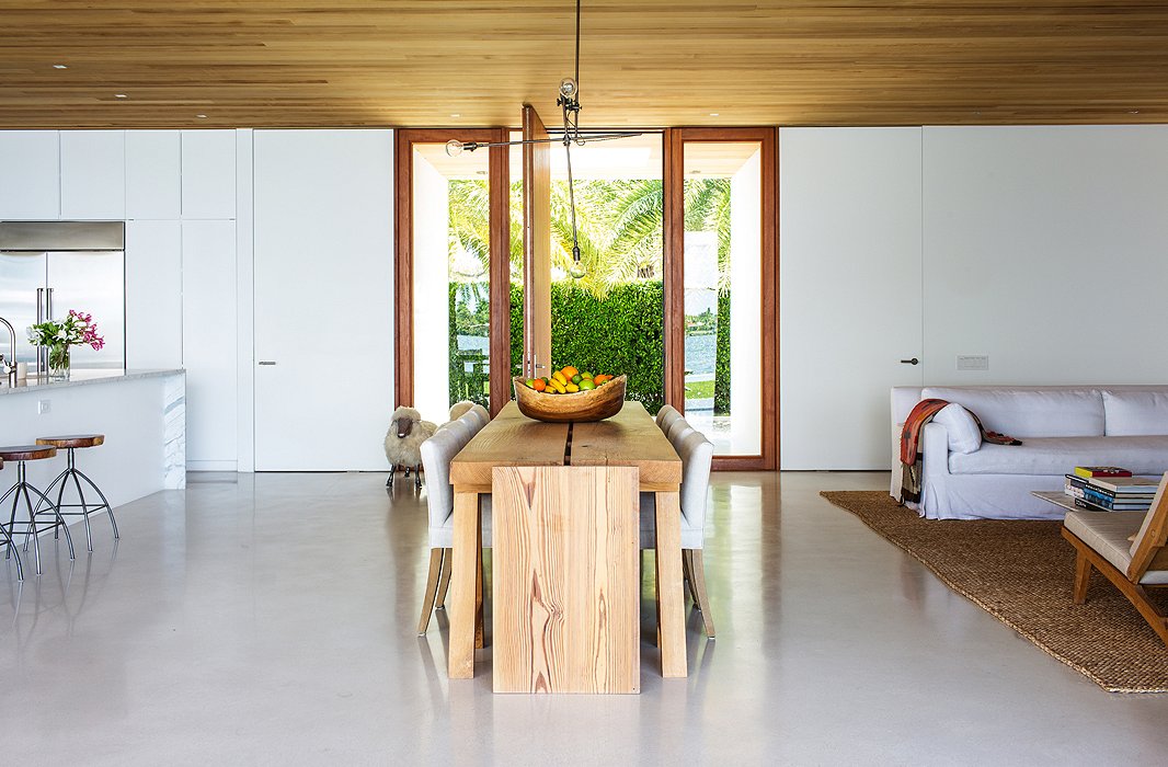 A restrained palette and unfinished woods lend a serene, casual look; the dining table was commissioned from Lars Bolander.
