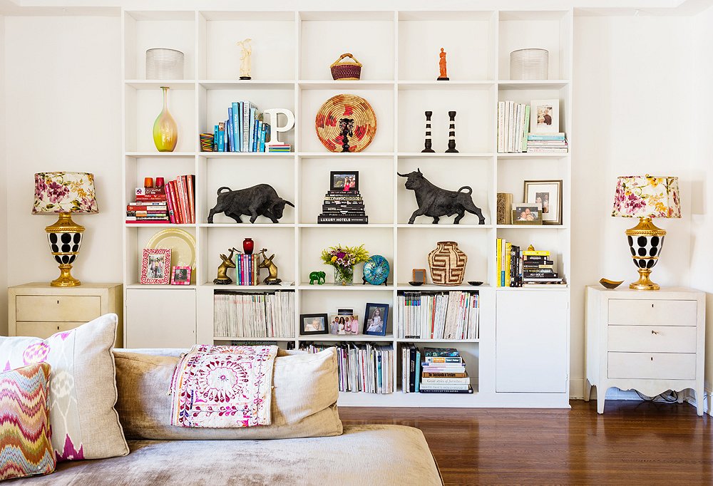 The bookshelves were arranged to highlight Kim’s favorite pieces—like the midcentury plaster bulls (she’s a Taurus)—and feel airy and orderly. Her tips: Color-coordinate to achieve calm, group smaller pieces when possible, and think both vertically and horizontally.
