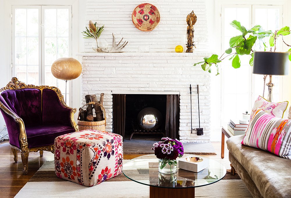 Beside the fireplace was one of two purple upholstered chairs that Kim scored at a Paris flea market and has had for more than 15 years. “They’ve worked in every home I’ve ever had,” she says. “They’re the perfect example of ‘buy what you love.’”
