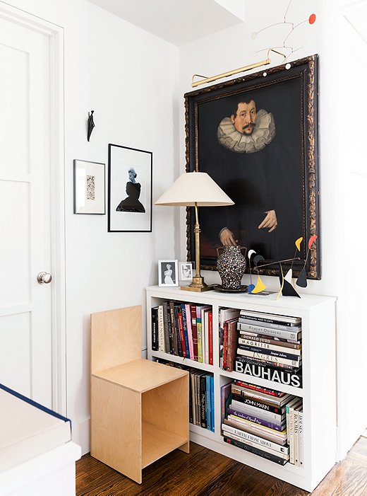 Proof that antique and modern objects can work together: A dark Flemish painting hangs above a chair designed by Donald Judd and alongside a black-and-white photograph of Marilyn Monroe taken by Bert Stern in 1962.
