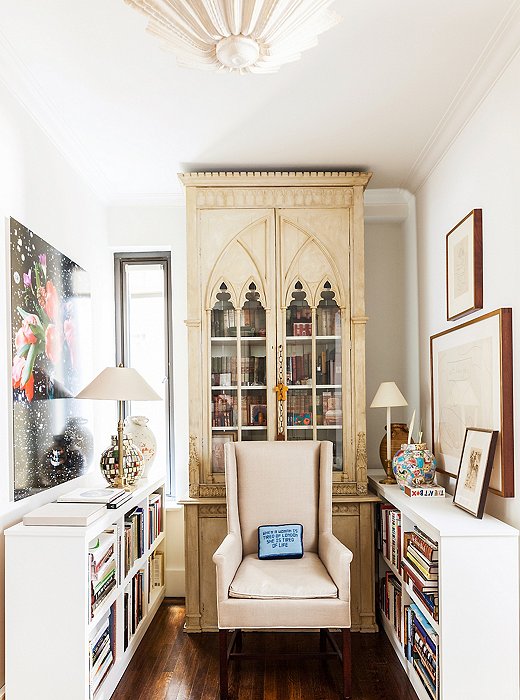 The Gothic cabinet that once occupied her London apartment now has pride of place in the library, which is also home to an invitingly comfortable armchair Mariette designed for Hickory Chair.

