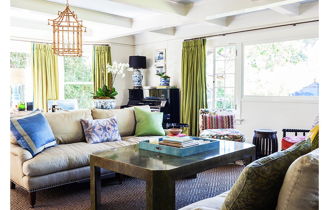 In the living room, Yager opted for a “chinoiserie overload”—bamboo lanterns by John Rosselli and plenty of blue-and-white ceramics—letting the Asian influence complement the home’s Craftsman bones.
