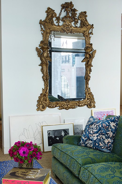 You’d probably never in a million years guess that this shot is of Aerin’s office, since it’s not, as she says, the “typical” office environment. Our favorites in this room include the green-velvet couch, the way its pattern riffs off that vibrant throw pillow, and how her art and photographs are so casually leaned up against the wall.