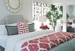 white bedding with colorful pillows