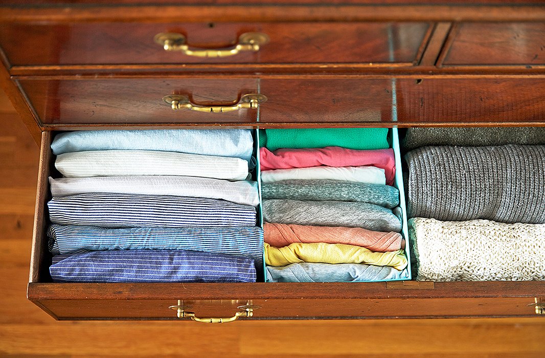 The dresser install, using a few shoeboxes. I even folded some of my husband’s striped shirts (on the left), just to inspire him to try this in his own drawers.
