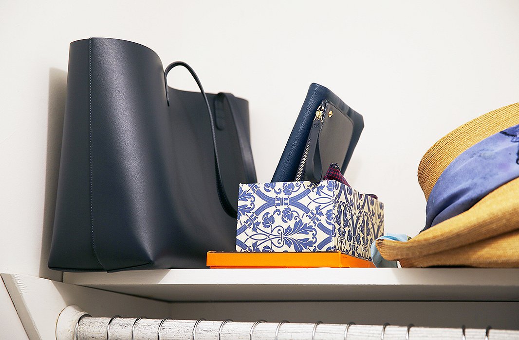 My bag in its proper resting place, alongside a little damask-covered box that holds a few clutches, making them visible and easy to grab when running out the door.
