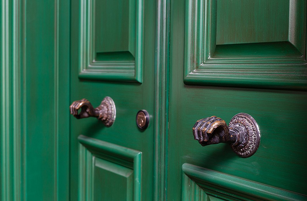 Opulence trickles down to the smallest of details in the house, such as sculptural doorknobs in the form of hands.
