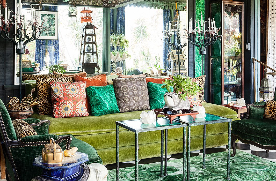 This garden room inside Dawnridge is testament to the late Duquette’s legacy and fearless approach to pattern: The walls are upholstered in the decorator’s malachite-print cotton fabric, which he designed for Jim Thompson, while the malachite-pattern silk rug was a design for Roubini.
