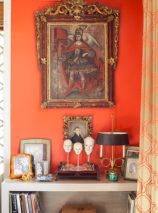 Pieces with special significance, including a small portrait of an ancestor, are showcased in a corner.
