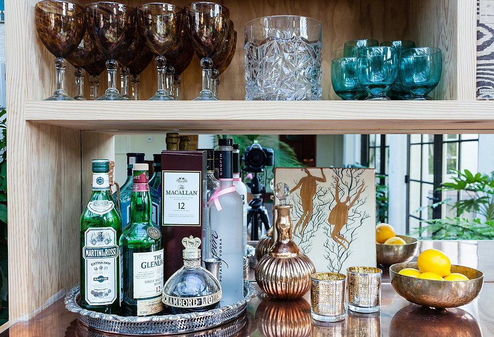 “I have a bit of a barware collection,” laughs Tarses. “Pieces from my wedding and from my grandma, and I just bought some new tortoise highballs from One Kings Lane that are on their way.” When she throws a party, she’ll set out a mix of glassware for guests.
