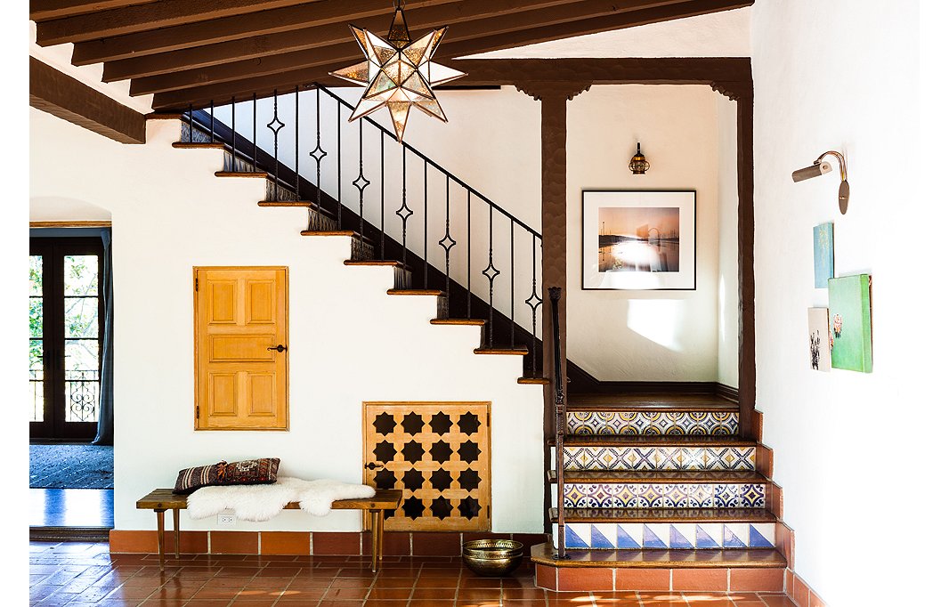 Colorful Spanish tiles and a Moravian star pendant set a statement-making scene in the entryway. Photo by Nicole LaMotte.
