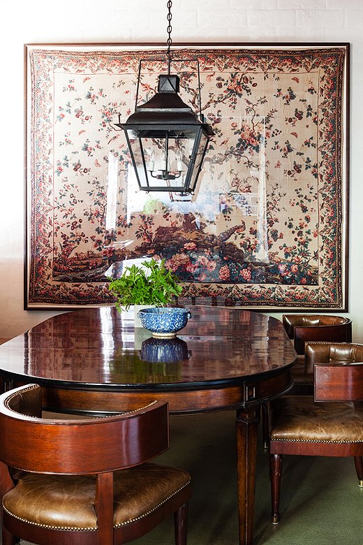 This gorgeous dining area is where Smith staffers generally gather for lunch. The framed document on the wall is part of Smith’s personal collection and was the inspiration for the Tree of Life pattern in his Jasper fabric line.
