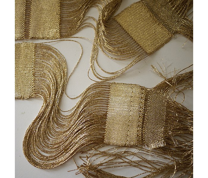 “It is believed that ancient Egyptians created gold wire by pulling soft ore into long, tiny threads, then they weaved these tiny gold threads into garments, wall ornamentations, and adornments,” says Ashbee.
