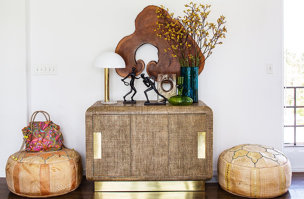 Not only are they versatile (and gorgeous), but leather poufs can easily be moved from room to room as well. Photo by Nicole LaMotte.
