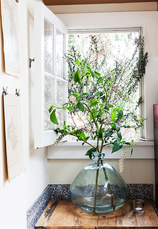 A mix of tree branches—any variety with smaller leaves will do—adds an easy rustic accent to any space. Photo by Nicole LaMotte. 
