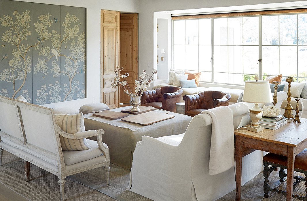 With a neutral palette, Brooke and Steve use a strong focal point in the living room: a striking wallpaper panel. “You think that a sofa or a chair has to be the focus,” says Brooke. “But it can be a piece of art or a window.”
