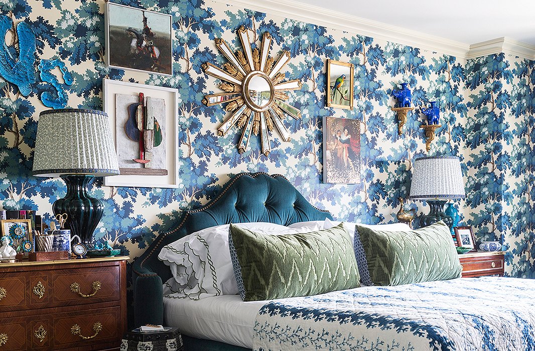 In true more is more style, designer Alex Papachristidis added a statement starburst mirror to his already showstopping bedroom wall.
