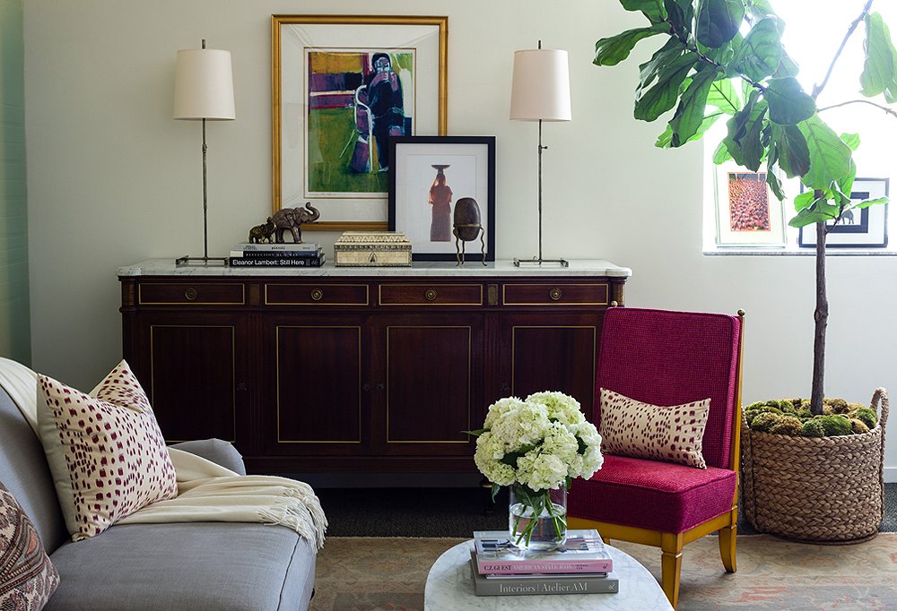 The credenza and the slipper chair were both discovered among One Kings Lane’s vintage offerings, while the pair of lamps are by Visual Comfort.
