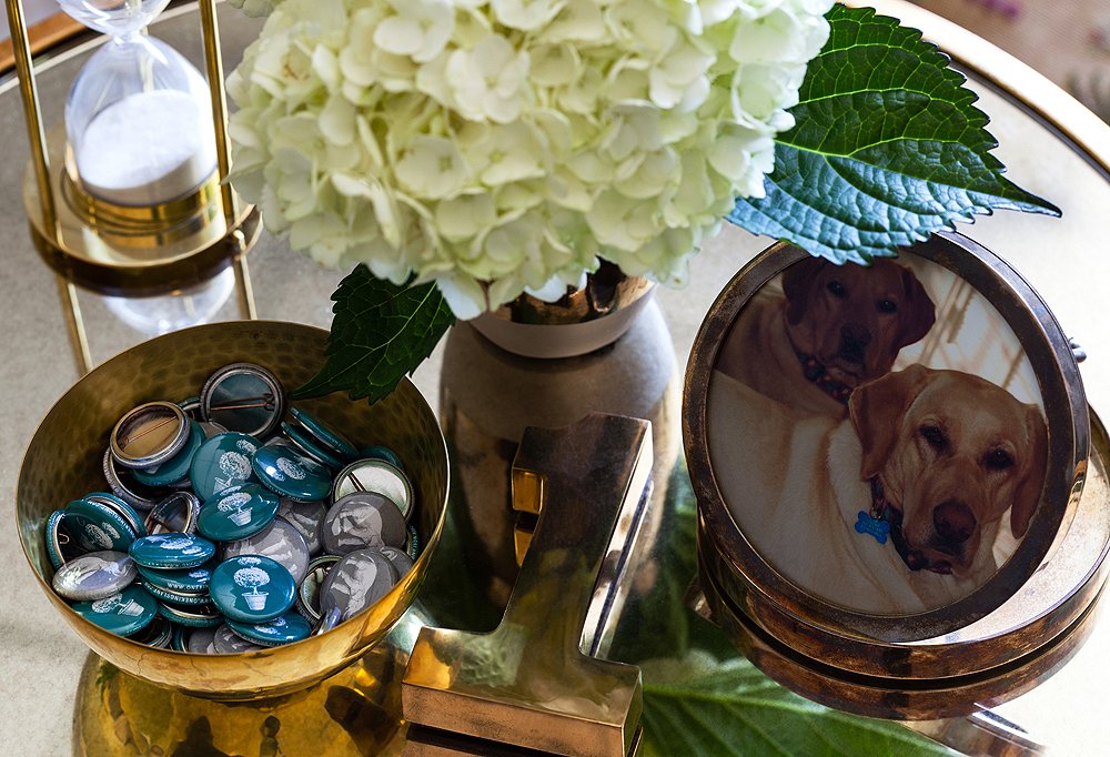 A bowl of buttons from a recent One Kings Lane party sits next to a framed picture of Susan’s two dogs, Maggie and Chloe. Hydrangeas are Susan’s office flower of choice.
