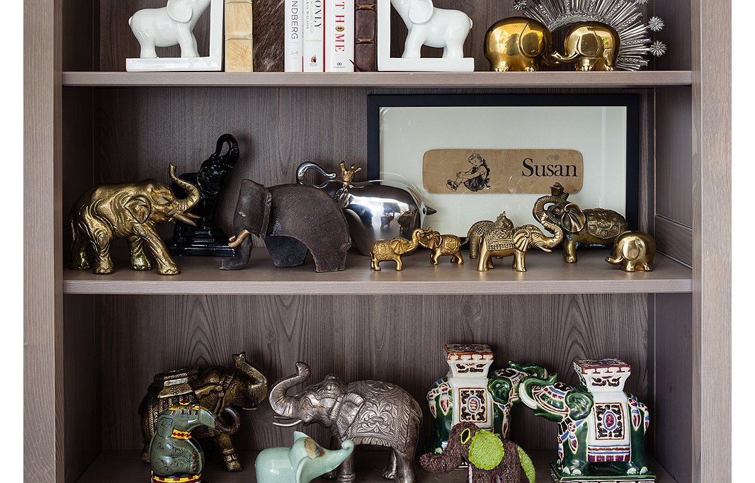 One Kings Lane co-founder Susan Feldman collects elephants. On her shelves figurines old and new, from all around the world, cavort together in one happy, harmonious herd.
