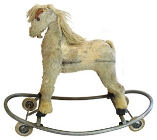 antique toy horse on wheels